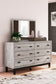 Vessalli King Panel Bed with Mirrored Dresser and Nightstand