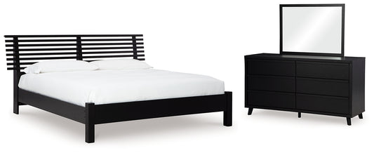 Danziar Queen Panel Bed with Mirrored Dresser